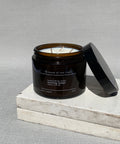 Morning forest candle with the lid off, showing the cotton wick and natural soy wax